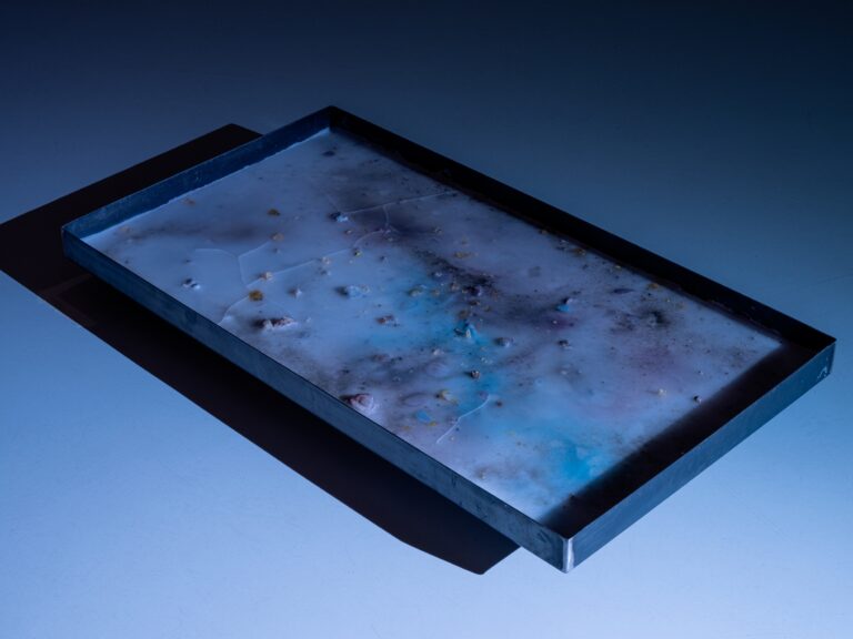 Natália Trejbalová, Travelling without moving, 2024 — paraffin, acrylic ink and various materials, iron tank